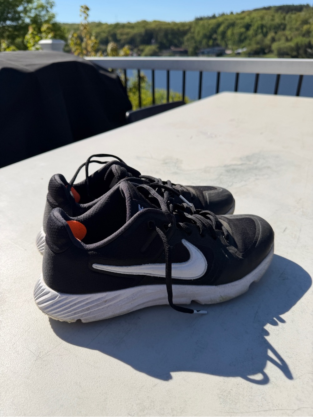 Men’s Nike Black Athletic Golf Shoes with White Swoosh and Orange Heel Accent